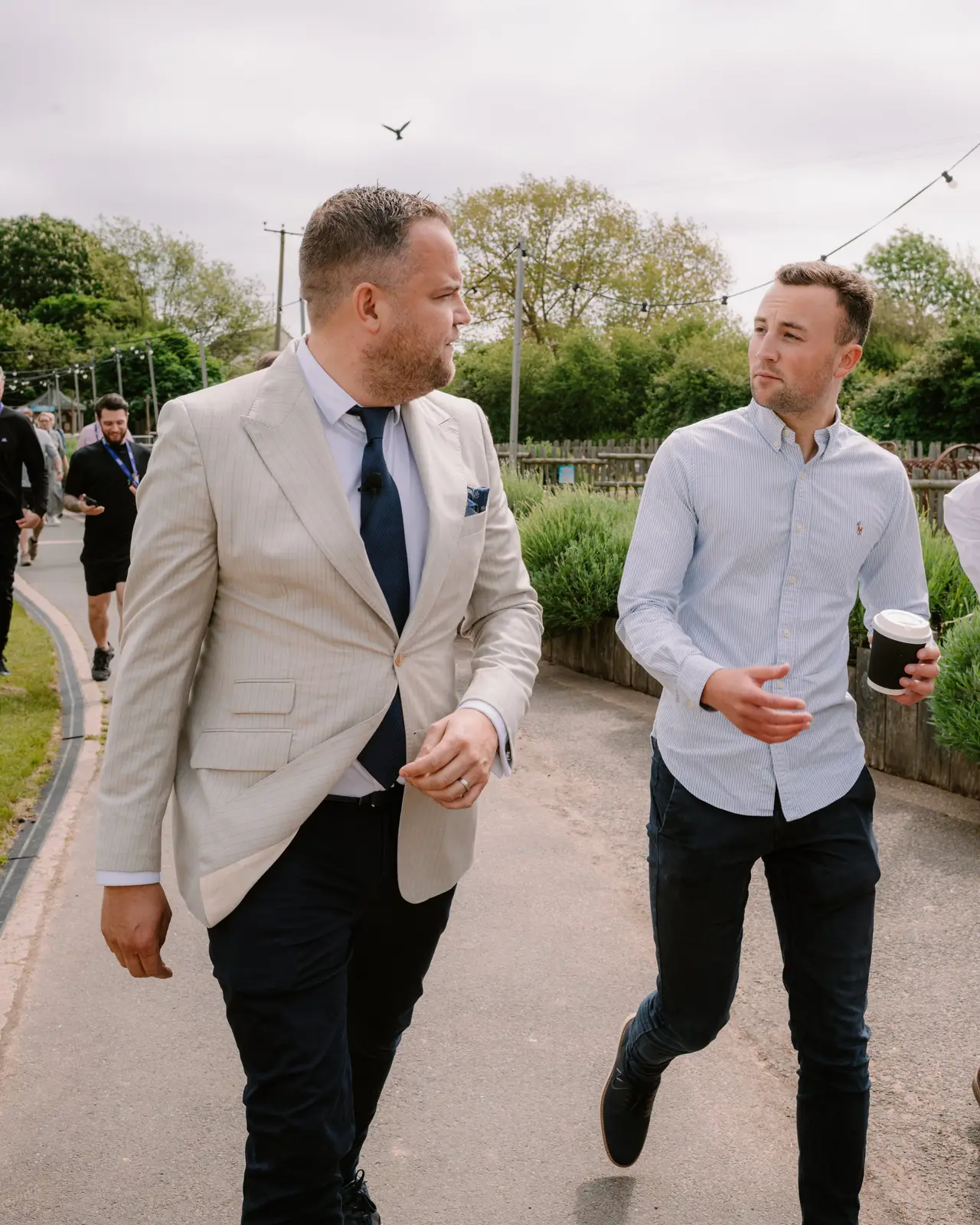 James walking and talking one to one with a business owner